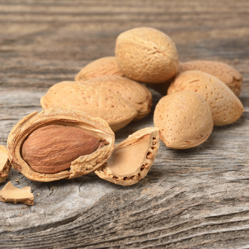 Almonds on a wooden surface