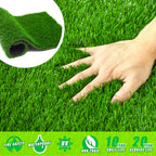 Artificial grass with a hand touching it, showing texture and close-up detail.
