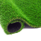 Roll of artificial grass with a textured black base