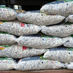 Stack of bags of chips with visible brand labels.