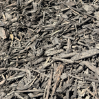Close-up of dark brown mulch or compost material