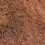 Close-up of brown mulch with a gradient effect