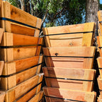 Stack of wooden crates with straps outdoors